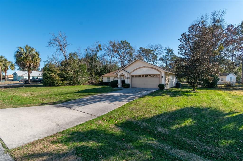 10795 Southwest 53rd Circle Ocala, FL 34476 - Photo 5 of 47 a house view with a outdoor space