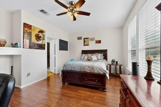 a bedroom with a bed and a couch