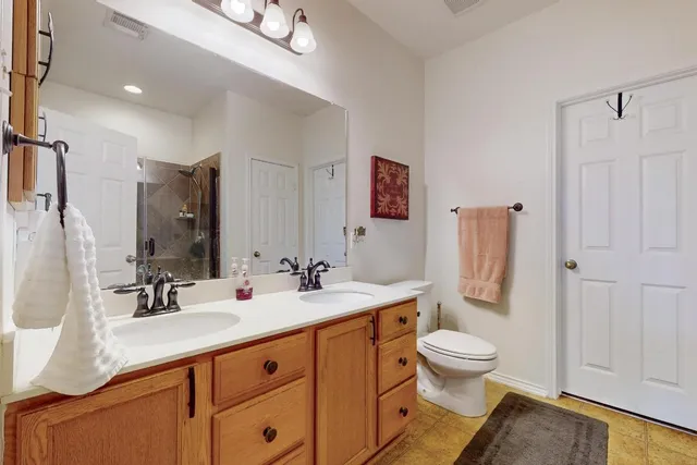 a bathroom with a shower and a sink