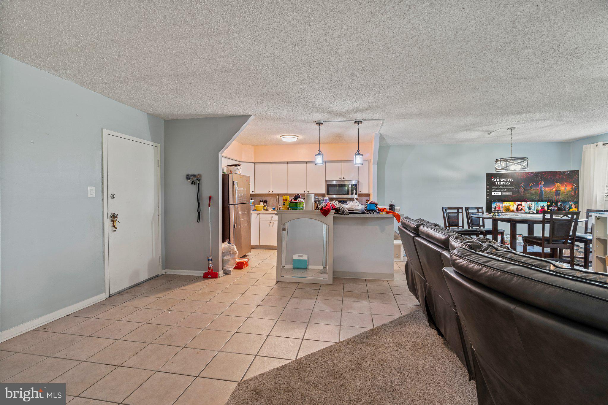 400 Glendale Road, Unit D51 Havertown, PA 19083 - Photo 16 of 17 a living room with furniture and a flat screen tv