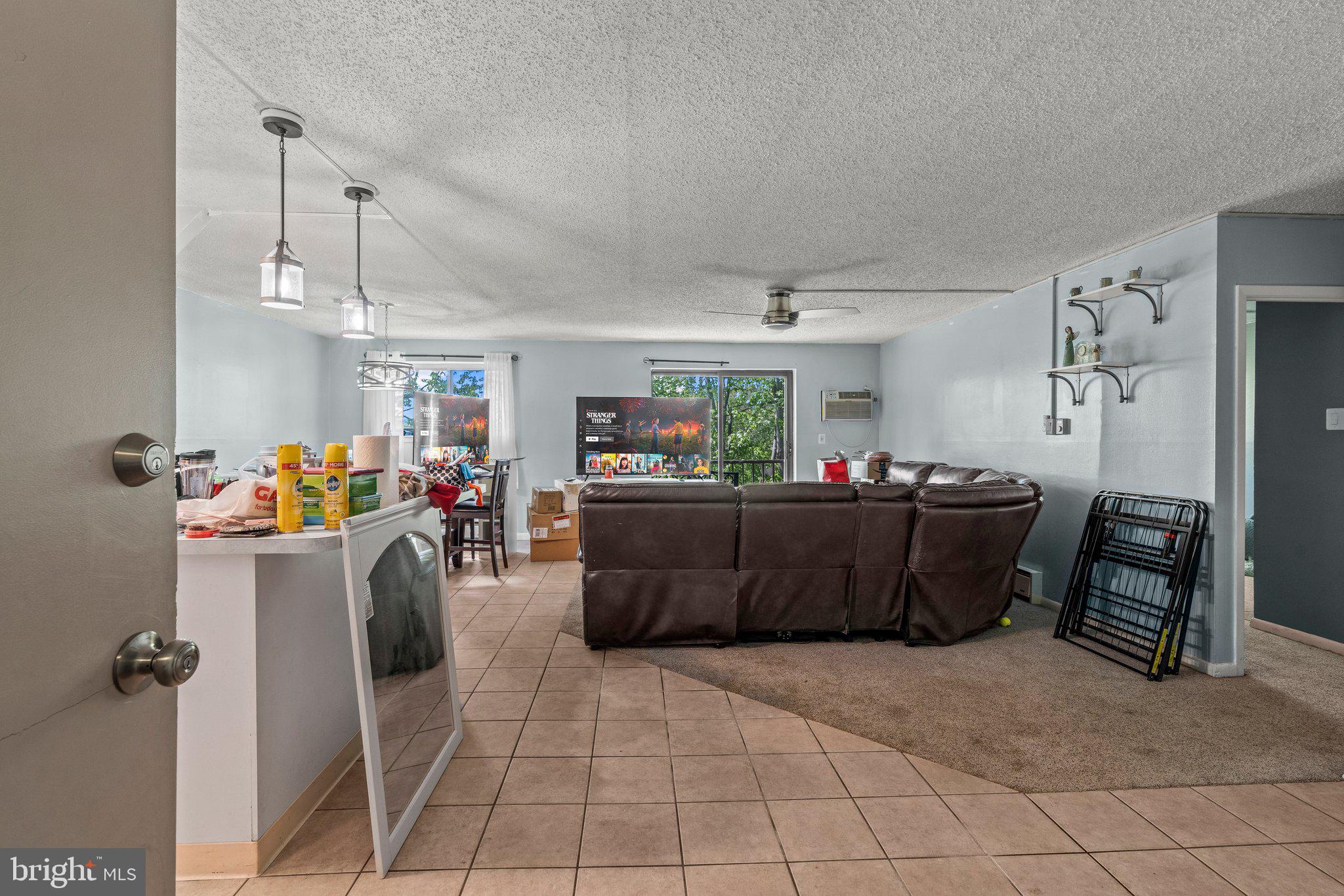 400 Glendale Road, Unit D51 Havertown, PA 19083 - Photo 3 of 17 a living room with furniture and a flat screen tv