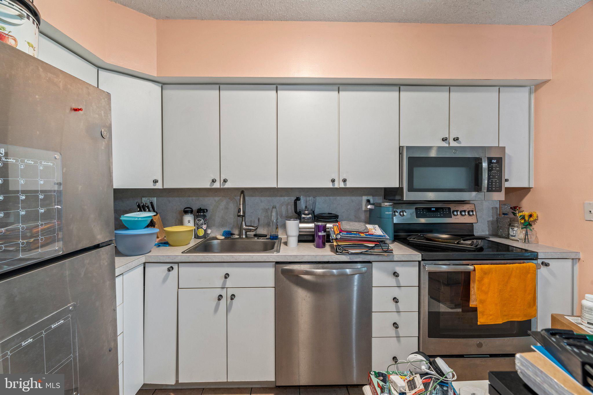 400 Glendale Road, Unit D51 Havertown, PA 19083 - Photo 5 of 17 a room with stainless steel appliances white cabinets and a sink