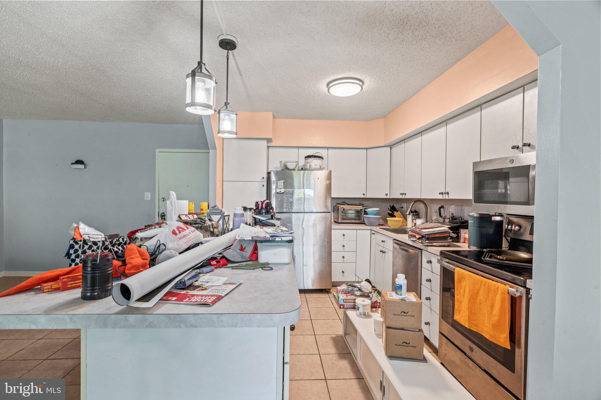 400 Glendale Road, Unit D51 Havertown, PA 19083 - Photo 8 of 17 a kitchen with stainless steel appliances granite countertop a sink and cabinets