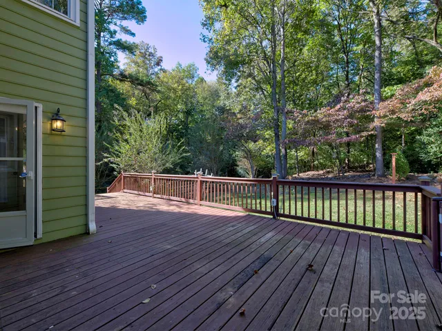 a view of balcony with wooden floor