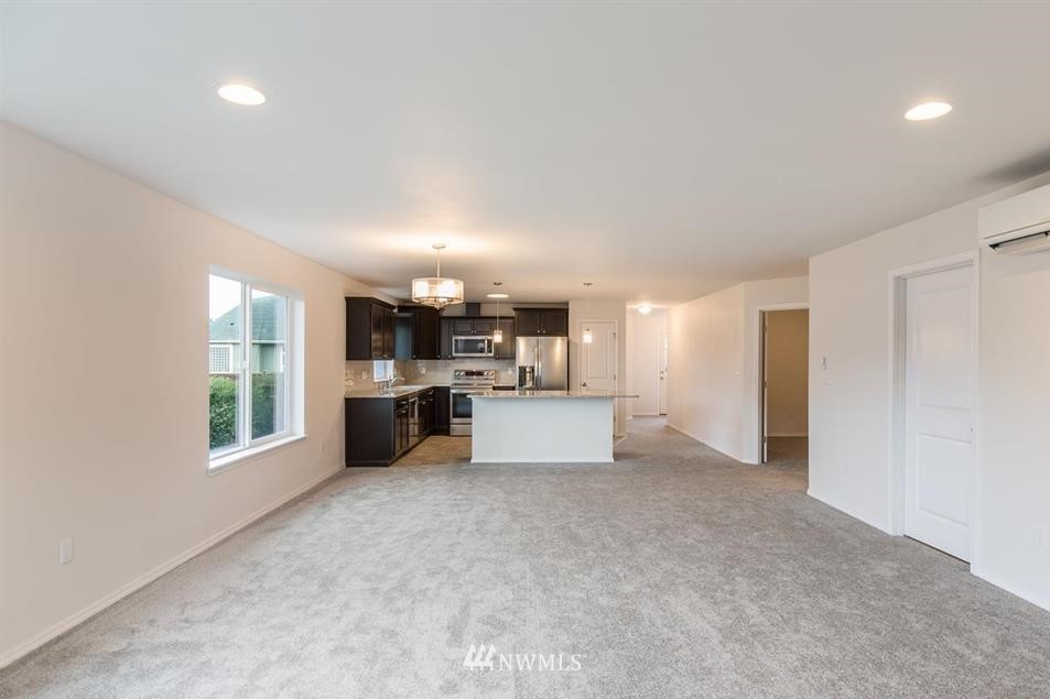 20 Jara Way Sequim, WA 98382 - Photo 9 of 27 a large room with a large window and a kitchen