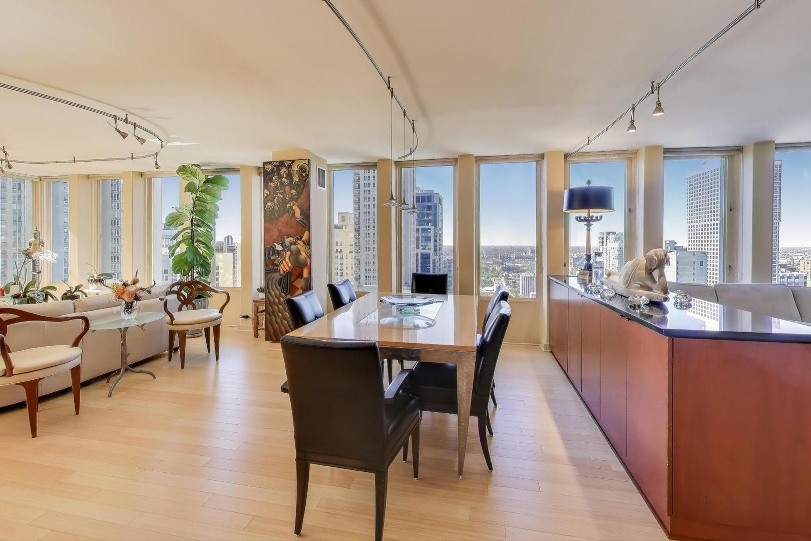 100 East Walton Street, Unit 42F Chicago, IL 60611 - Photo 12 of 50 a view of a dining room with furniture window and outside view