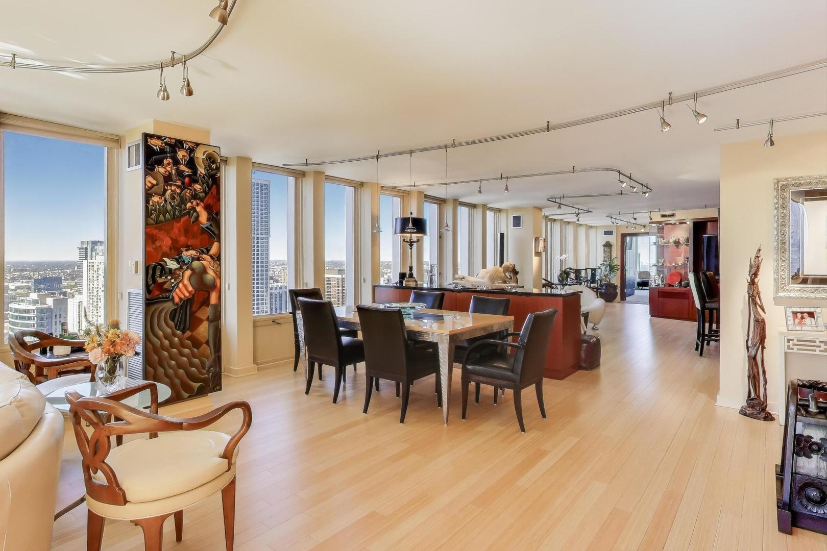 100 East Walton Street, Unit 42F Chicago, IL 60611 - Photo 13 of 50 a view of a dining room with furniture window and outside view