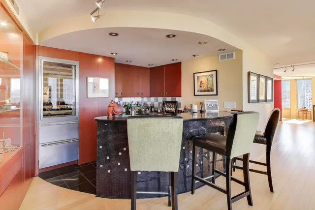 a room with lots of appliances and cabinets