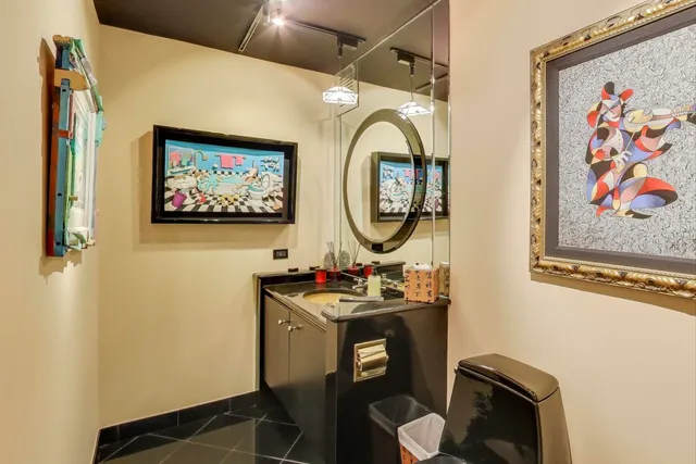 a bed room with a bed and a large mirror