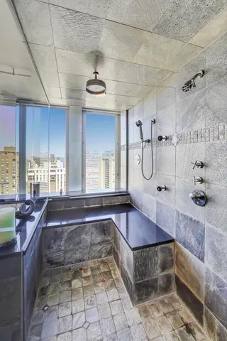 a view of a livingroom with workspace and a couch