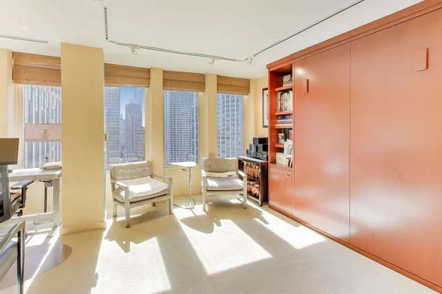 a bathroom with a tub and shower