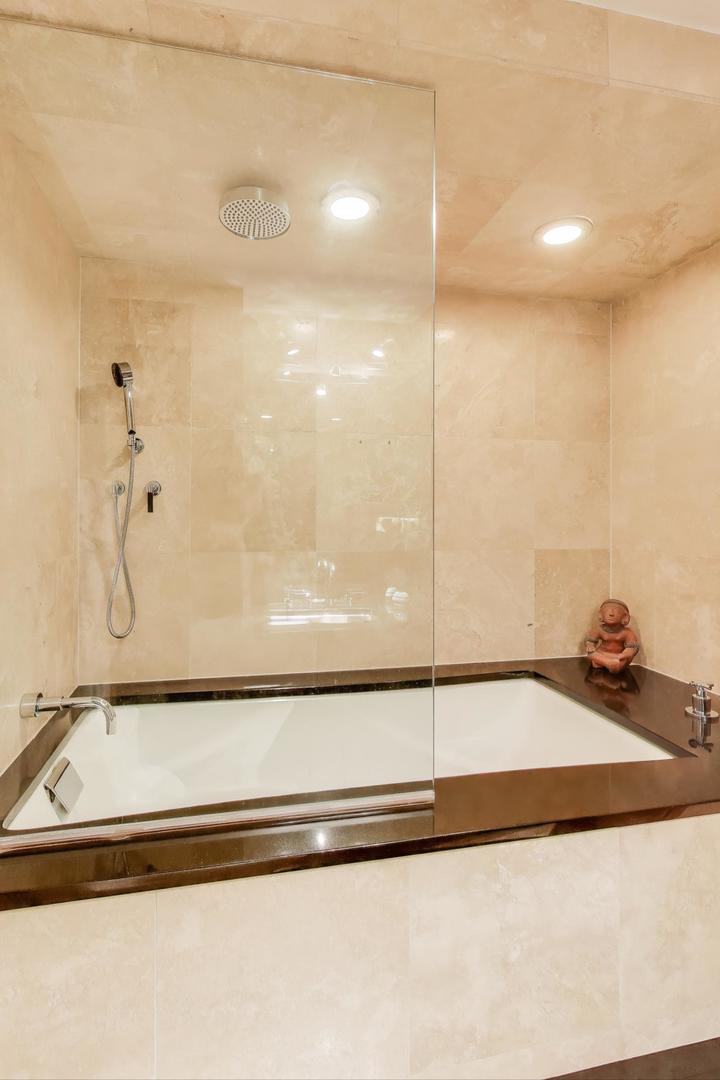 100 East Walton Street, Unit 42F Chicago, IL 60611 - Photo 39 of 50 a bathroom with a tub and shower