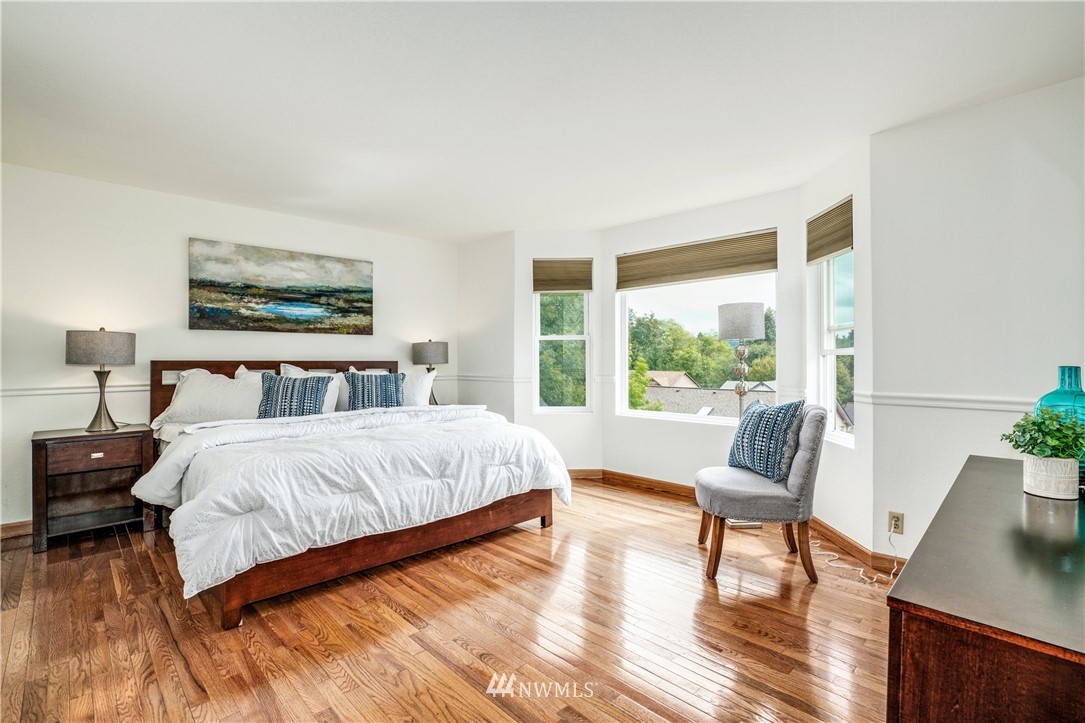 527 224 Place Southeast Bothell, WA 98021 - Photo 11 of 23 a bedroom with a bed and a large window