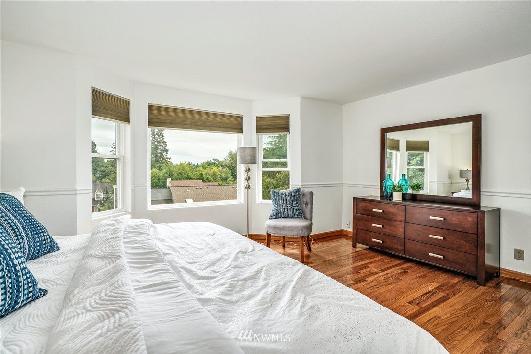 527 224 Place Southeast Bothell, WA 98021 - Photo 12 of 23 a bedroom with a bed and a dresser next to a window