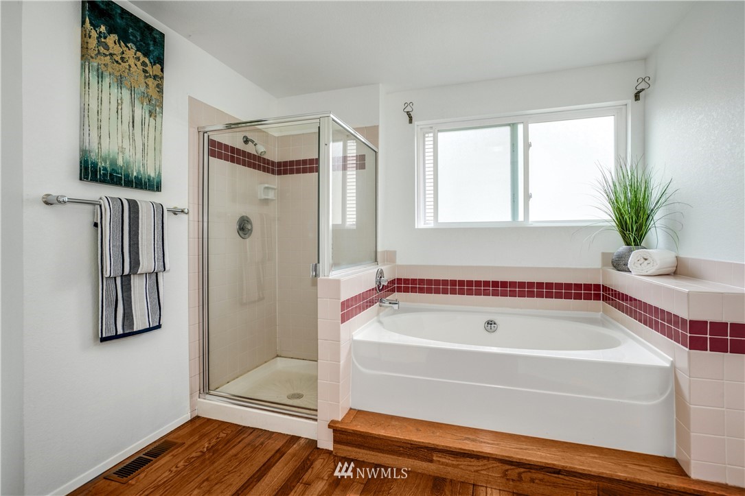 527 224 Place Southeast Bothell, WA 98021 - Photo 14 of 23 a bathroom with a bathtub and a shower