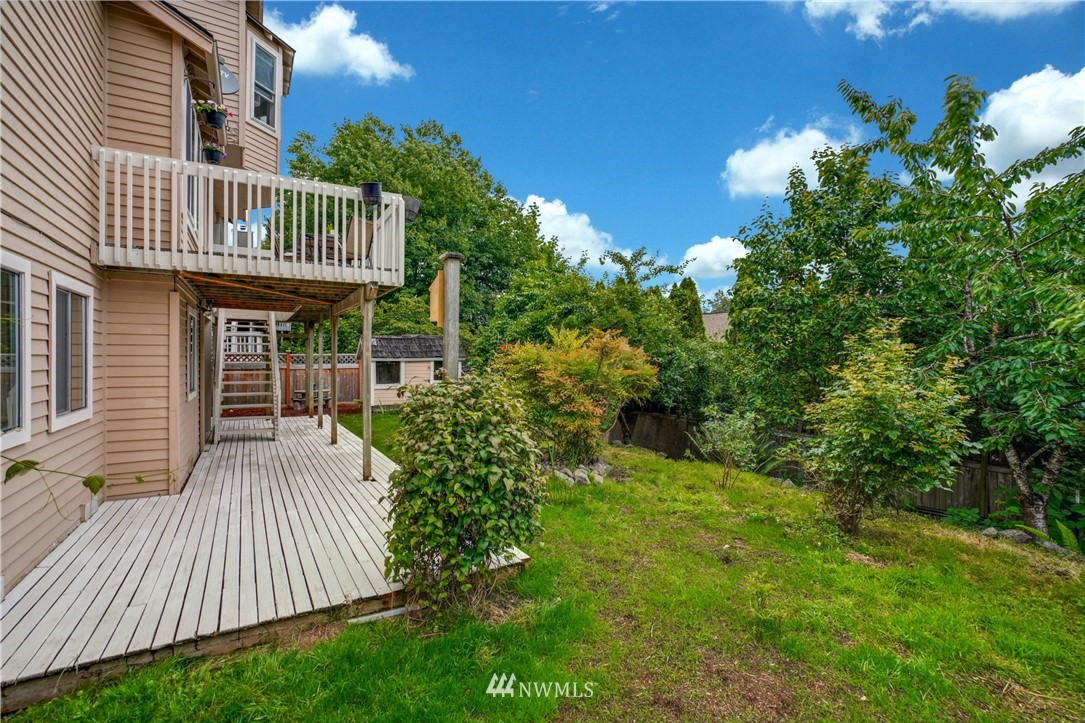 527 224 Place Southeast Bothell, WA 98021 - Photo 22 of 23 a view of backyard with deck and outdoor seating
