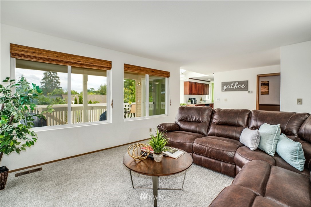 527 224 Place Southeast Bothell, WA 98021 - Photo 9 of 23 a living room with furniture and a potted plant