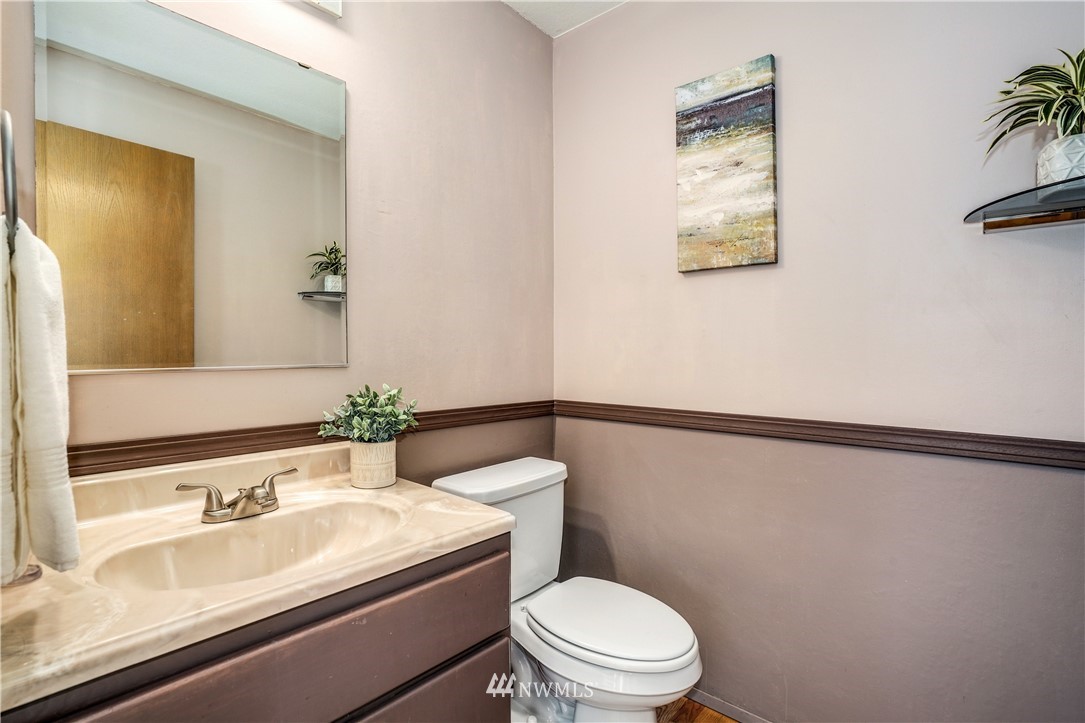 527 224 Place Southeast Bothell, WA 98021 - Photo 10 of 23 a bathroom with a sink a toilet and mirror