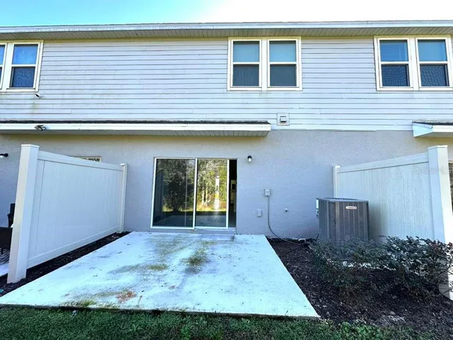 a view of a backyard of the house