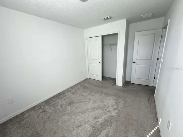 a view of a room with an empty space