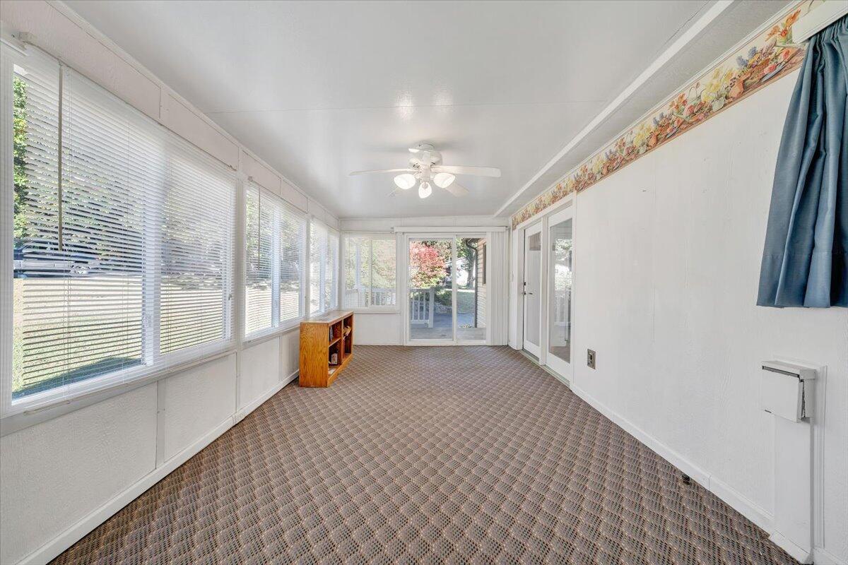 1900 Kiska Road Salem, VA 24153 - Photo 12 of 43 a view of an empty room with wooden floor and a window
