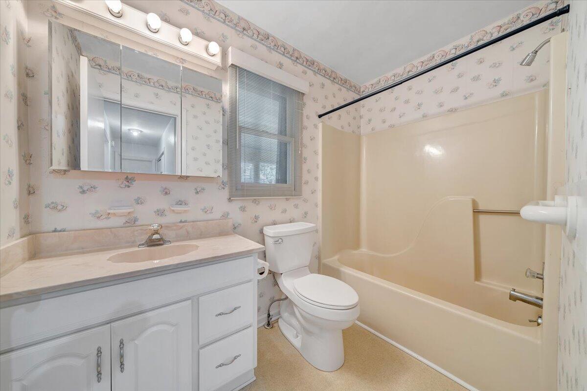 1900 Kiska Road Salem, VA 24153 - Photo 13 of 43 a bathroom with a sink a toilet and shower