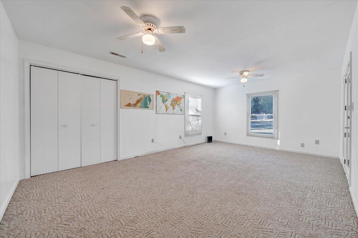 1900 Kiska Road Salem, VA 24153 - Photo 14 of 43 a view of an empty room with closet and a ceiling fan