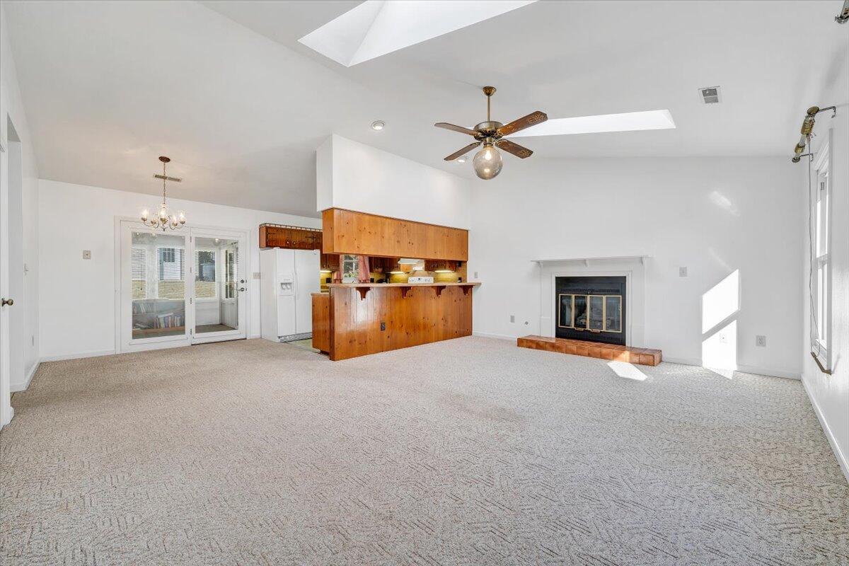 1900 Kiska Road Salem, VA 24153 - Photo 2 of 43 a view of a livingroom with a fireplace and a ceiling fan