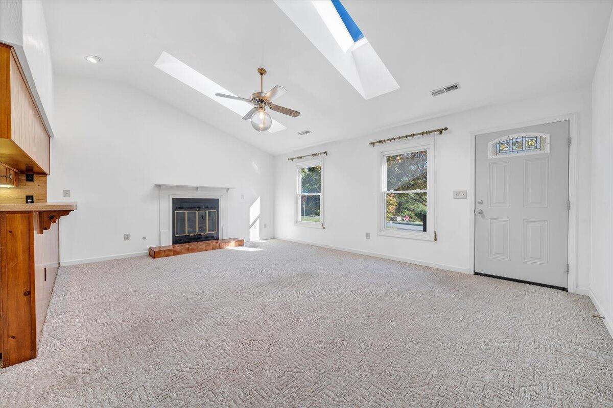 1900 Kiska Road Salem, VA 24153 - Photo 4 of 43 an empty room with windows and fireplace