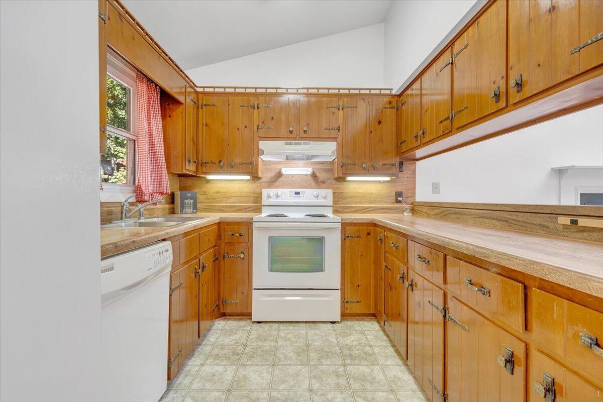 1900 Kiska Road Salem, VA 24153 - Photo 7 of 43 a kitchen with a stove top oven sink and cabinets
