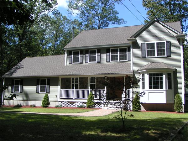 10 Longfellow Road Groton, MA 01450 - Photo 1 of 1 a front view of a house with a yard
