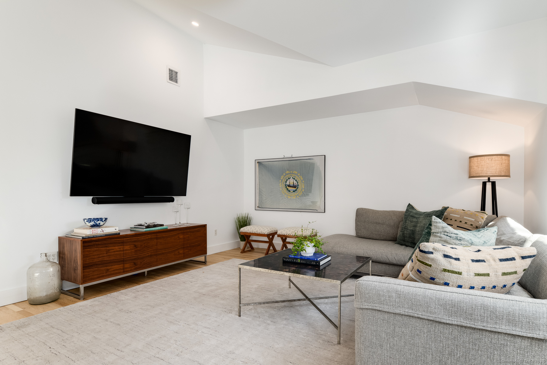12 Libby Lane Darien, CT 06820 - Photo 12 of 36 a living room with furniture and a flat screen tv