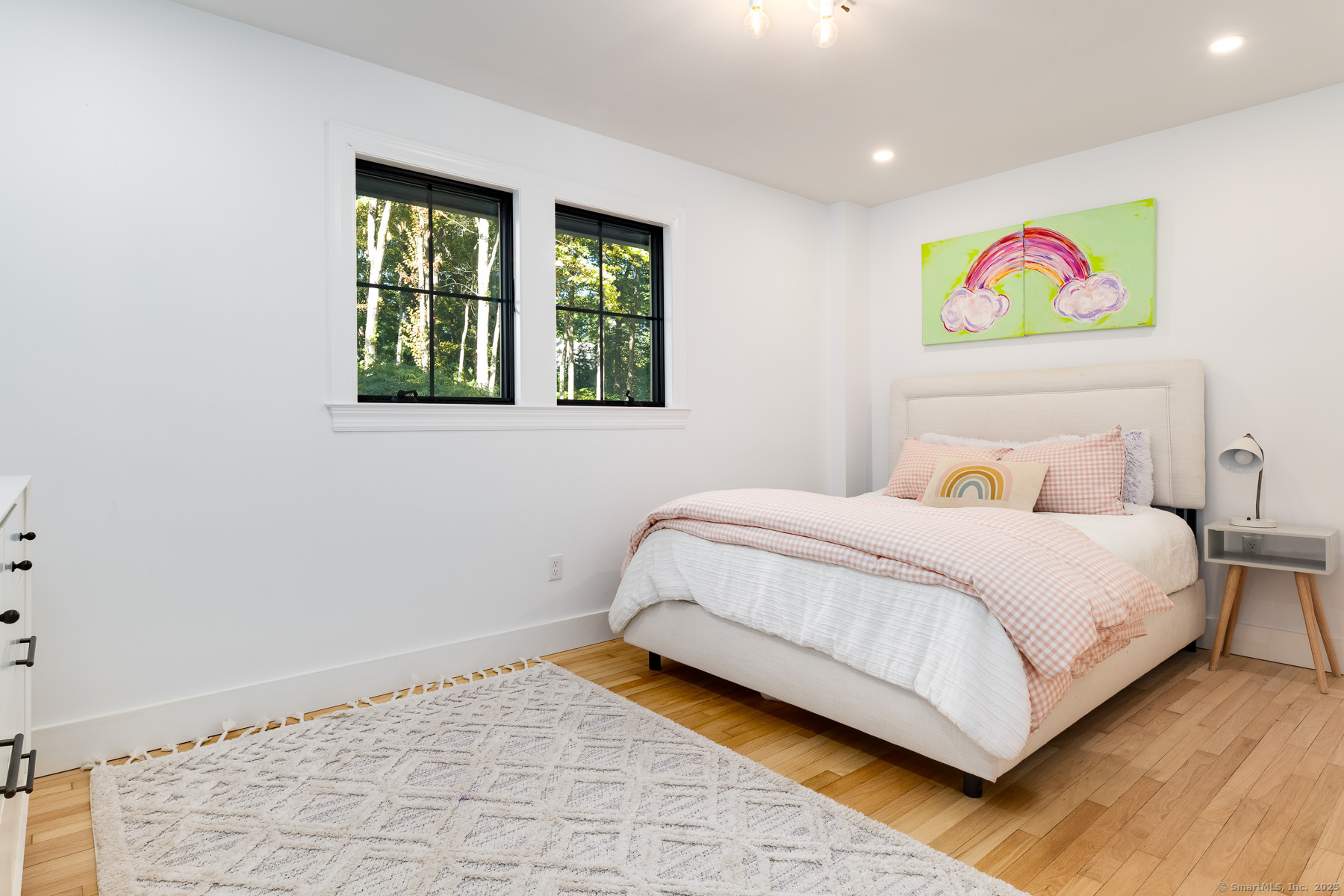 12 Libby Lane Darien, CT 06820 - Photo 18 of 36 a bedroom with a bed and glass window