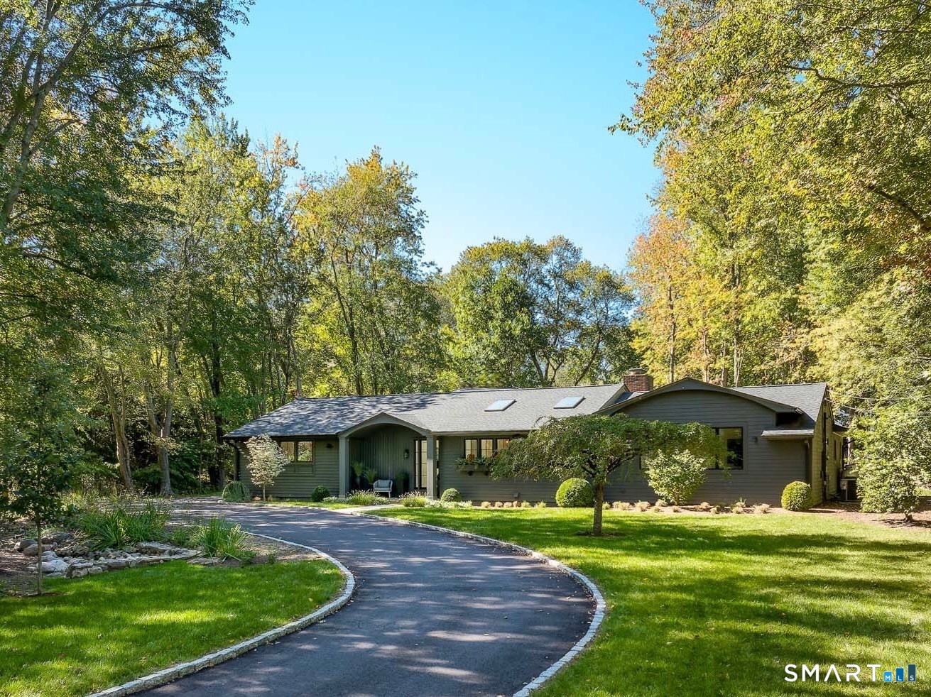 12 Libby Lane Darien, CT 06820 - Photo 2 of 36 a view of a wooden house with a yard