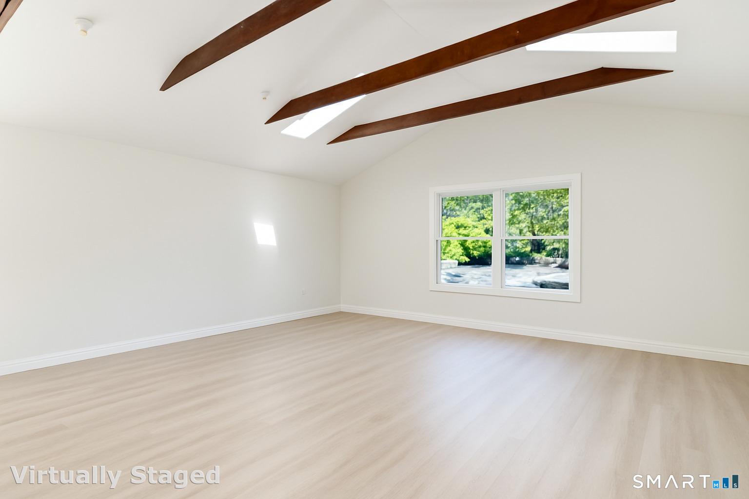 12 Libby Lane Darien, CT 06820 - Photo 23 of 36 a view of an empty room with a window