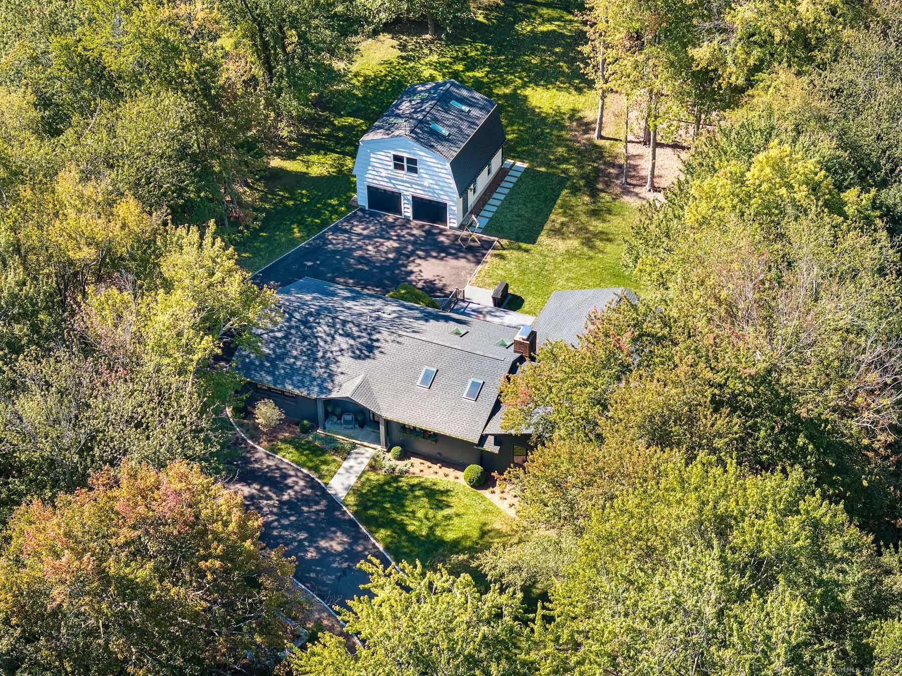 12 Libby Lane Darien, CT 06820 - Photo 28 of 36 an aerial view of a house with a yard and large tree