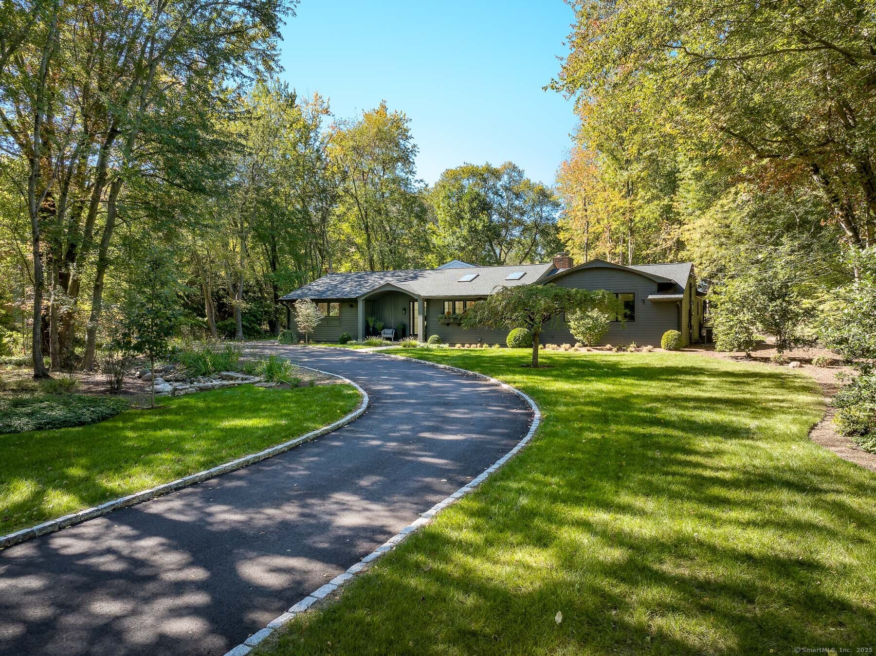 12 Libby Lane Darien, CT 06820 - Photo 30 of 36 a front view of a house with garden