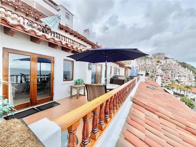 a view of a balcony with an outdoor space