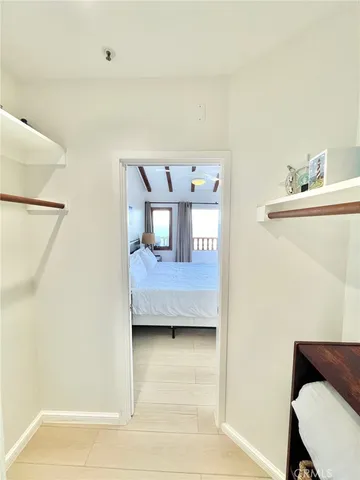 a view of hall way with furniture