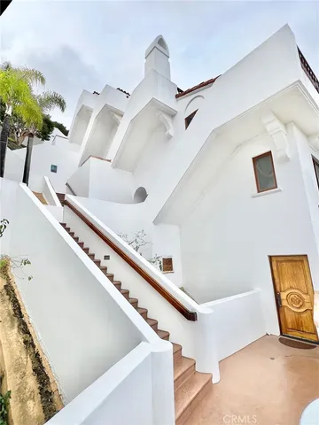 a bathroom with a bathtub and a chandelier
