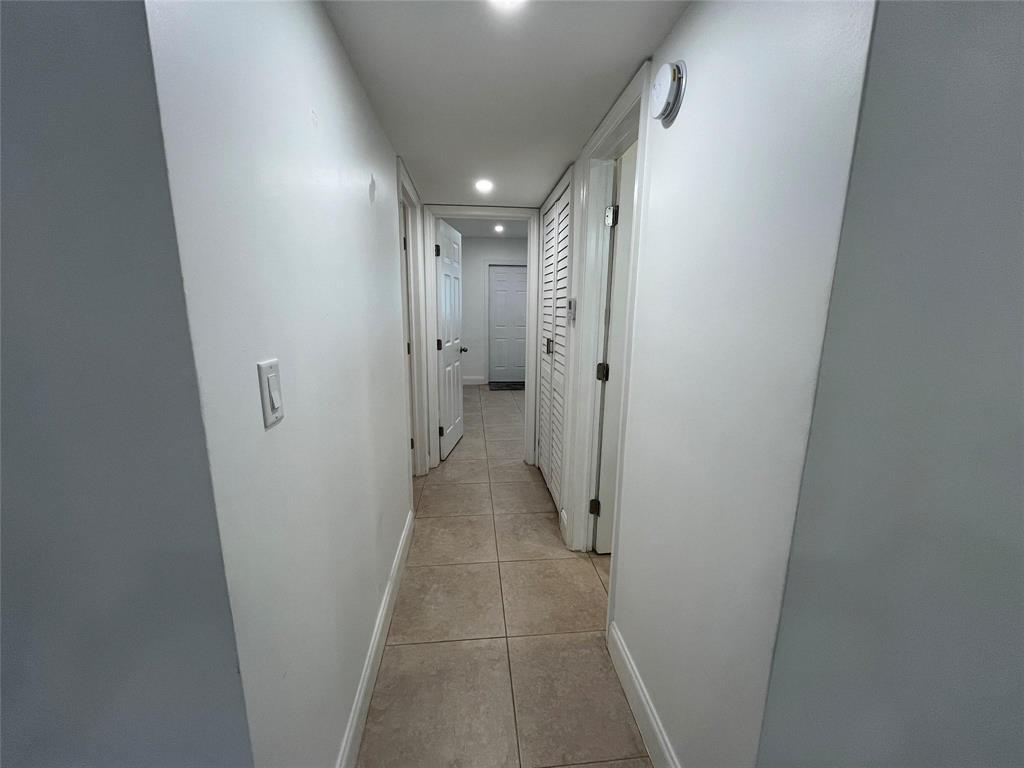 2100 Northeast 38th Street, Unit 128 Lighthouse Point, FL 33064 - Photo 11 of 28 Nance hallway photos