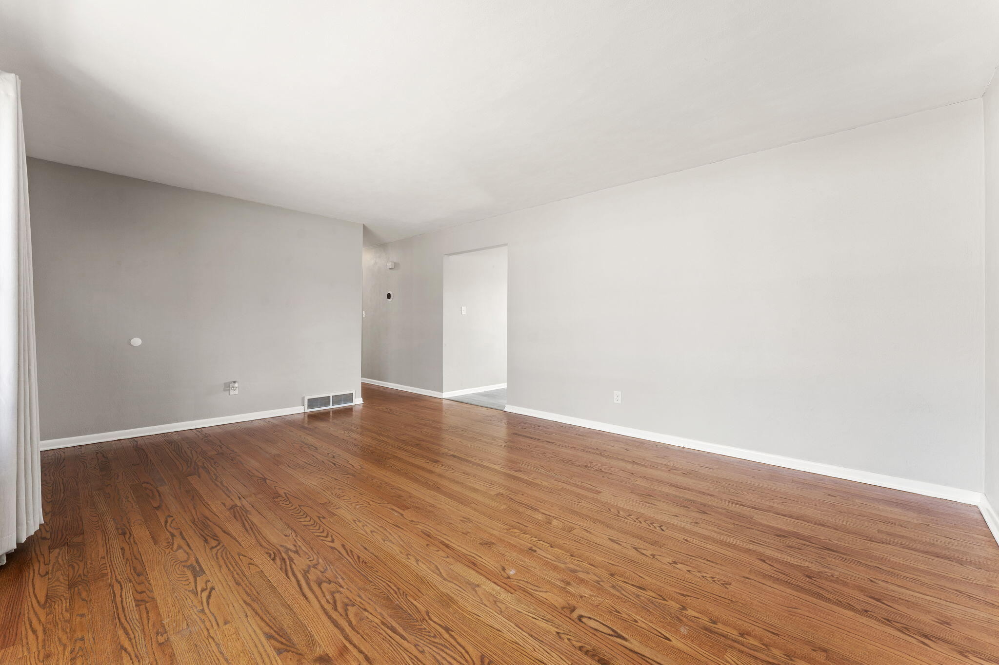 947 North Wood Street Griffith, IN 46319 - Photo 3 of 25 a view of an empty room with wooden floor