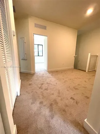 a view of an empty room and window