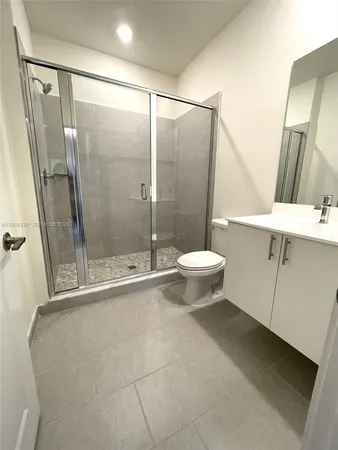 a bathroom with a shower and a toilet