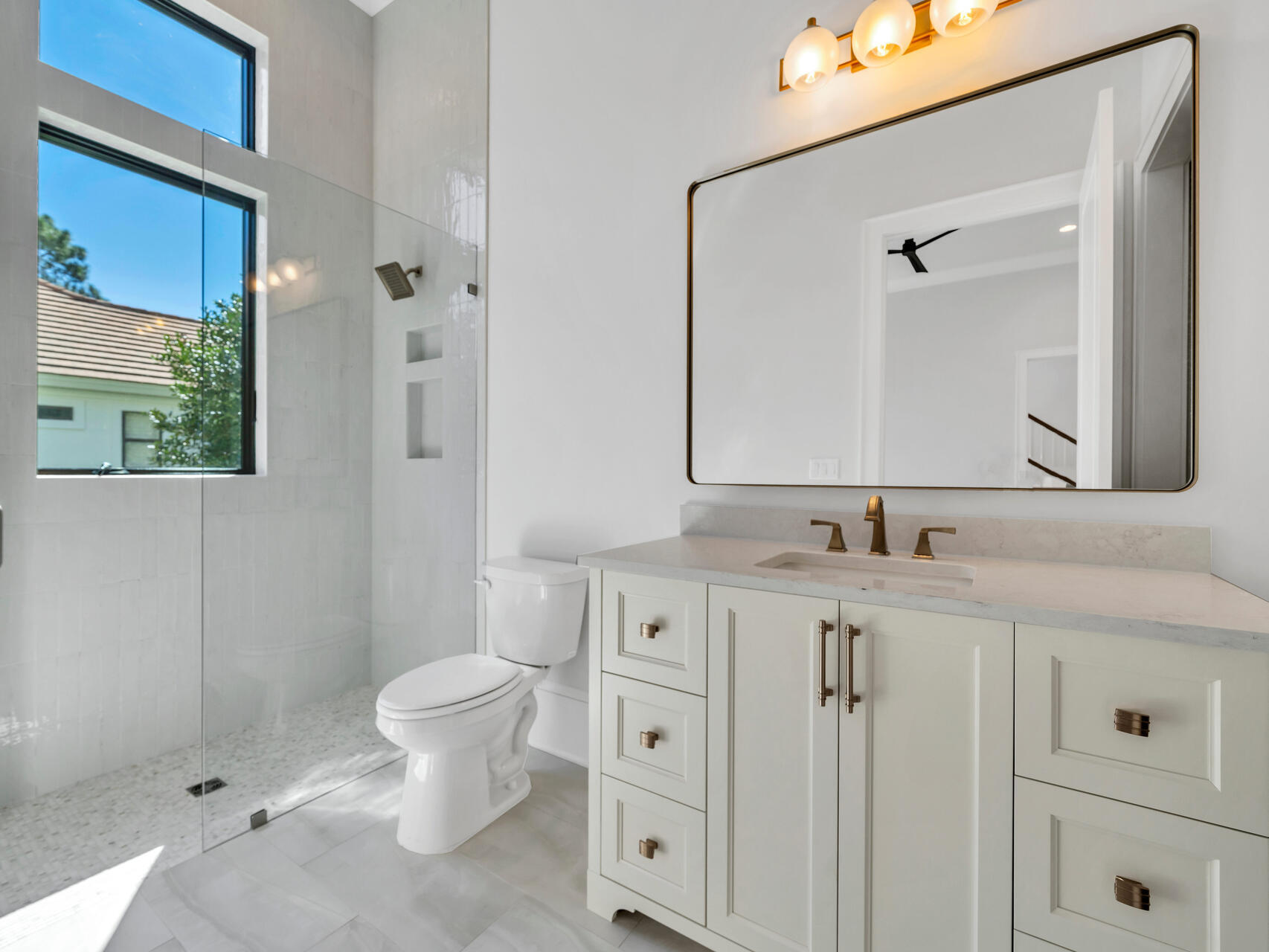 3526 Burnt Pine Lane Miramar Beach, FL 32550 - Photo 32 of 49 a bathroom with a granite countertop sink a toilet and a mirror