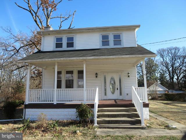 7604 North Point Road Baltimore, MD 21219 - Photo 1 of 13 a front view of a house with a yard