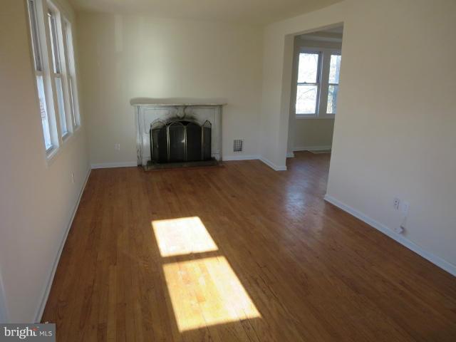 7604 North Point Road Baltimore, MD 21219 - Photo 2 of 13 a view of wooden floor and windows in a room