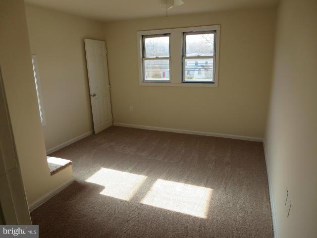 7604 North Point Road Baltimore, MD 21219 - Photo 11 of 13 an empty room with windows