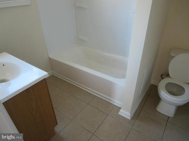 7604 North Point Road Baltimore, MD 21219 - Photo 12 of 13 a bathroom with a sink and toilet
