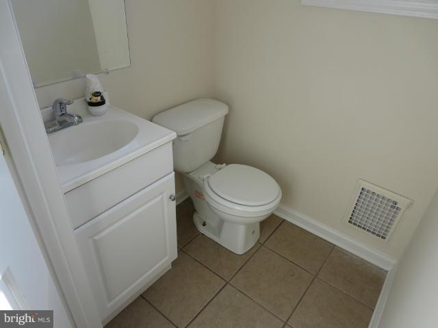 7604 North Point Road Baltimore, MD 21219 - Photo 6 of 13 a bathroom with a toilet and a sink